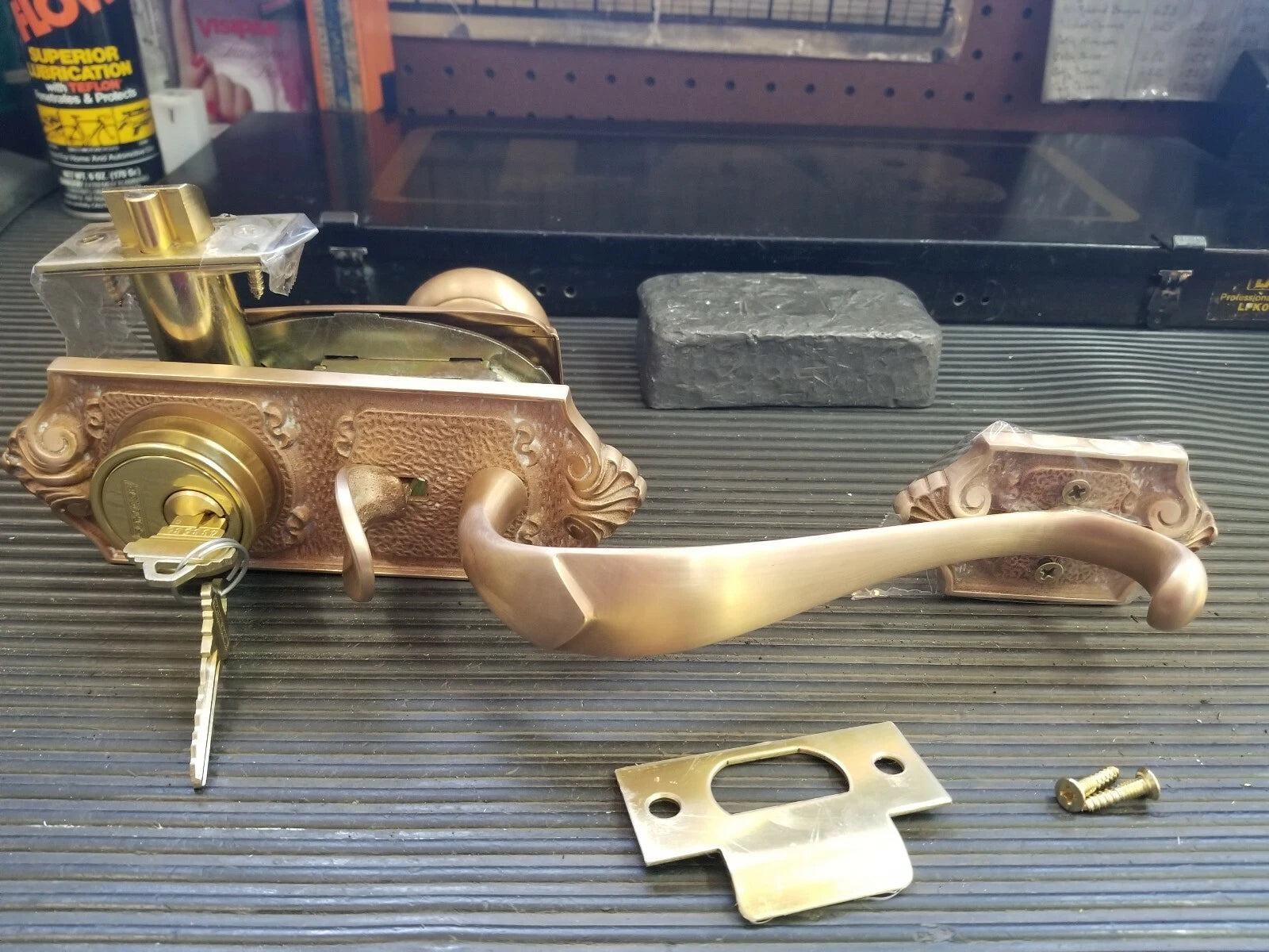 Schlage E Series Handleset 612 Parthenon Design with strike plate