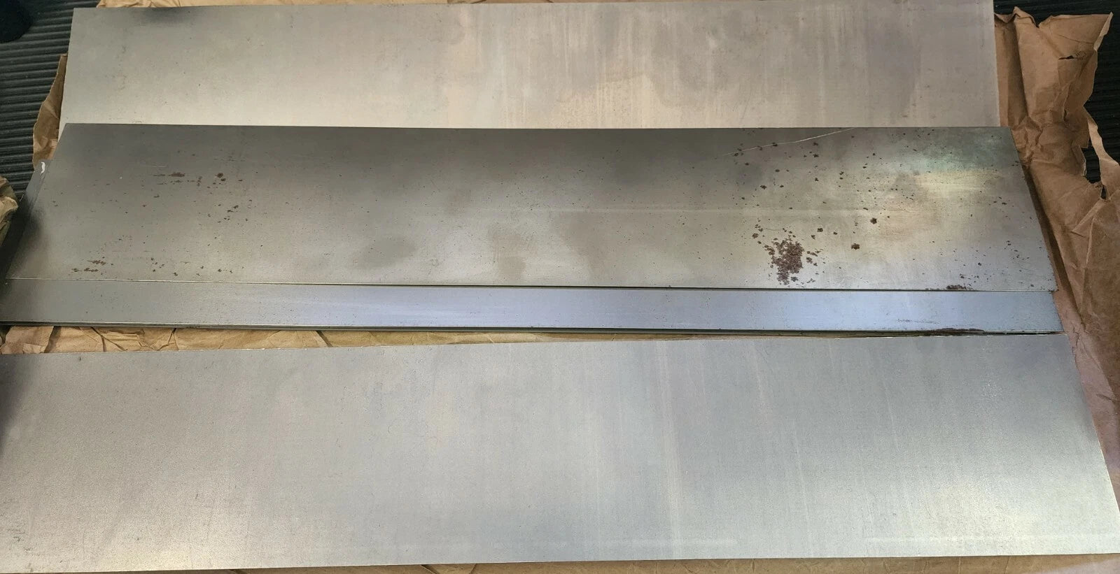 Steel Alloy Sheets 9 Pieces 4" W X 24" L X 1/4" thick.  Sold as one lot.