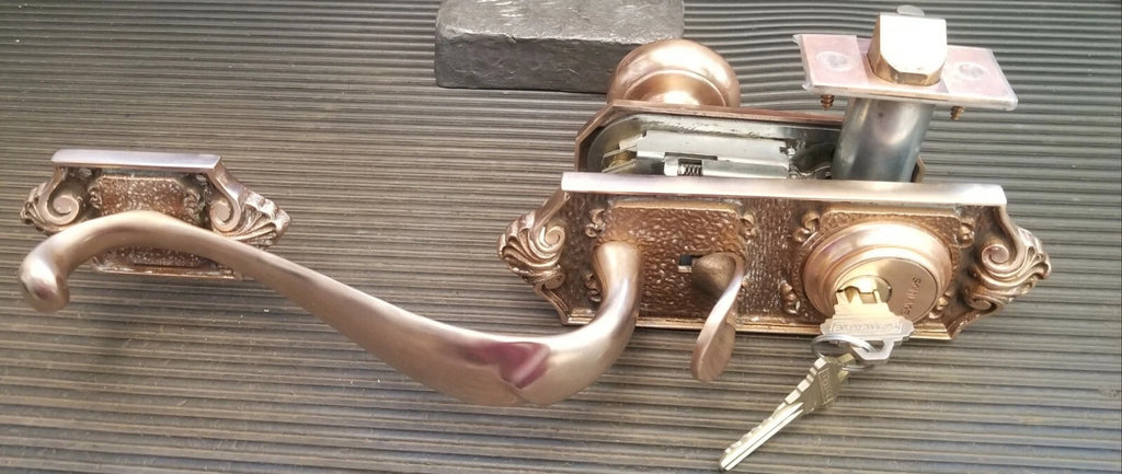 Schlage E Series Handleset 612 Satin Brass finish Parthenon Design
