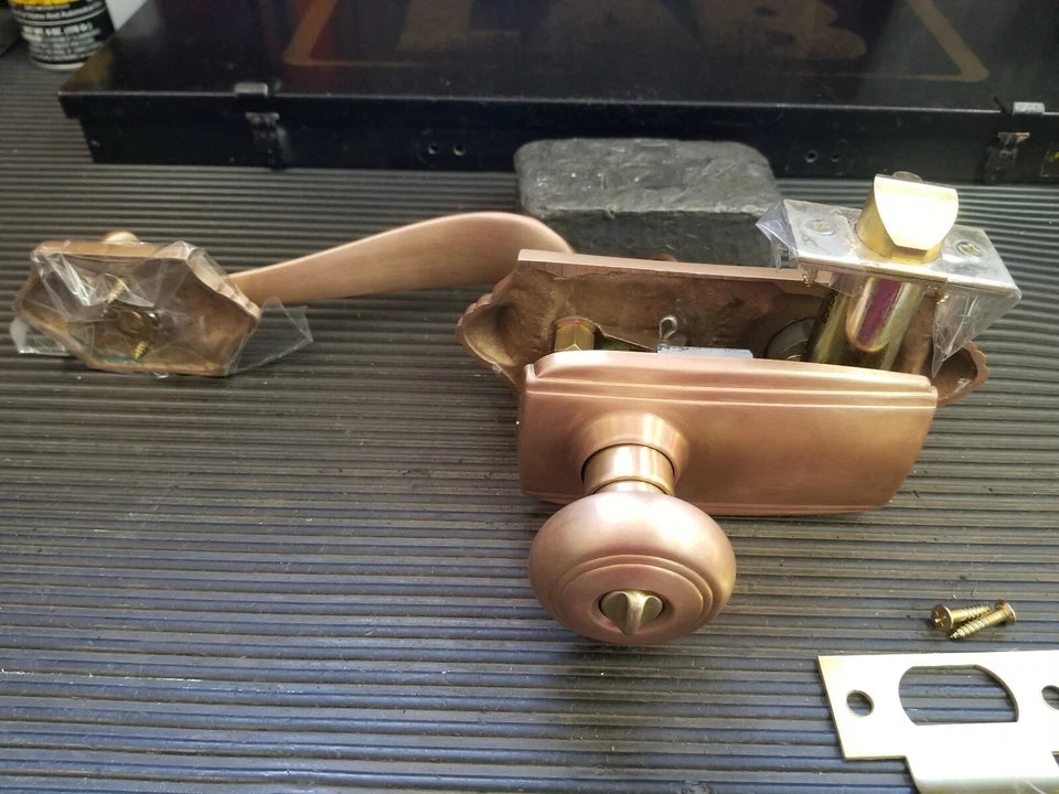 Schlage E Series Handleset 612 Parthenon Design with strike plate
